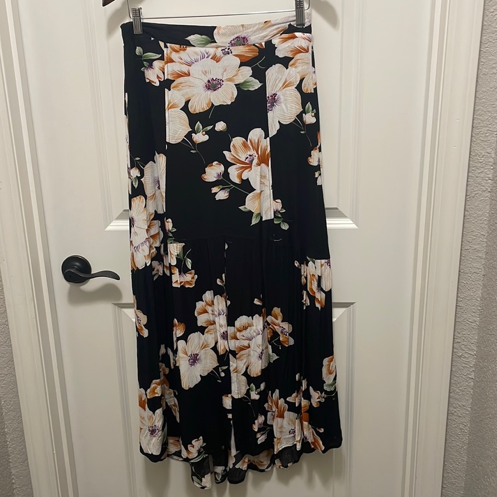 LLove black & floral maxi skirt size M semi high/low w/ slit at bottom of skirt